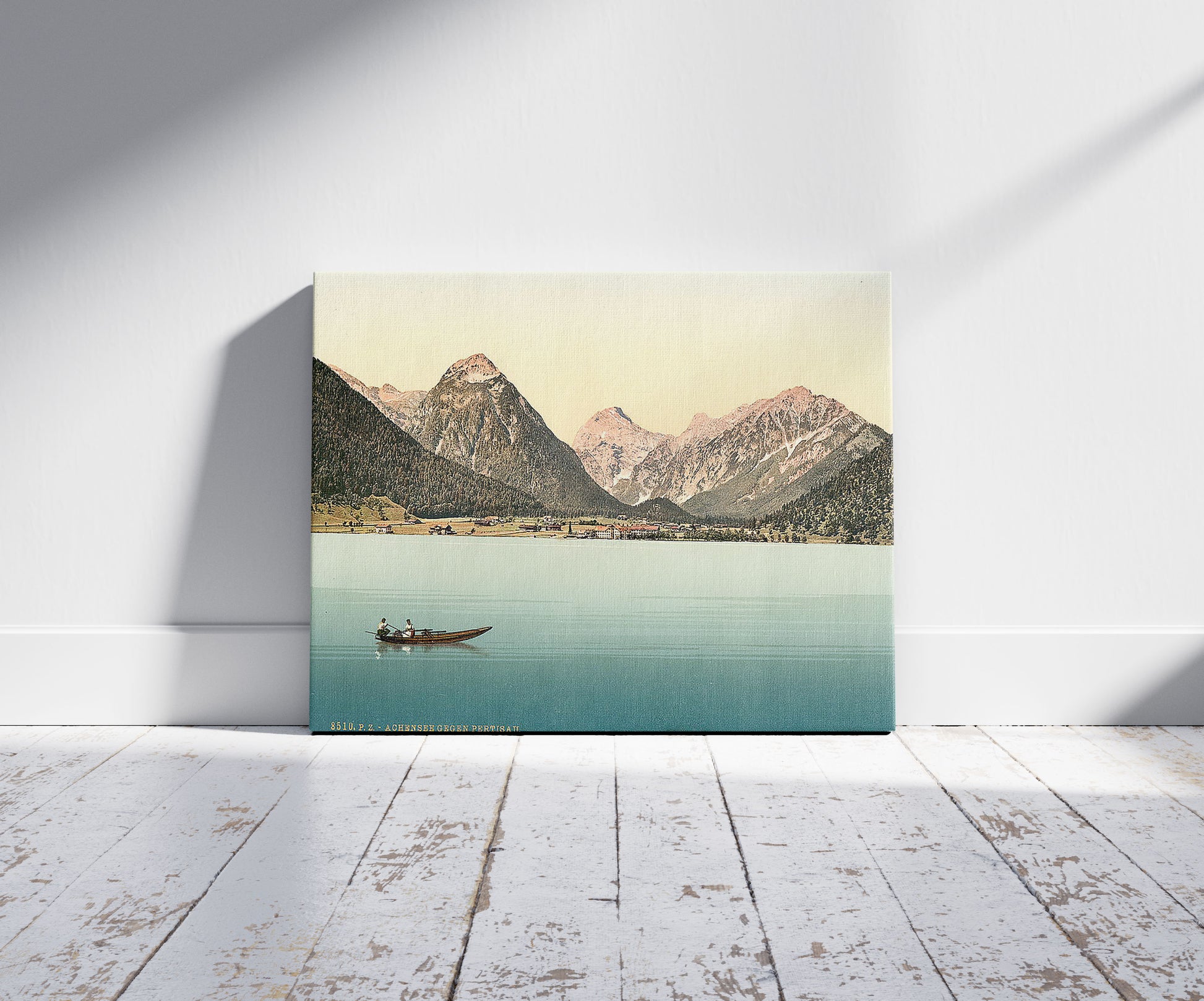 A picture of Achensee, towards Pertisau, Tyrol, Austro-Hungary, a mockup of the print leaning against a wall
