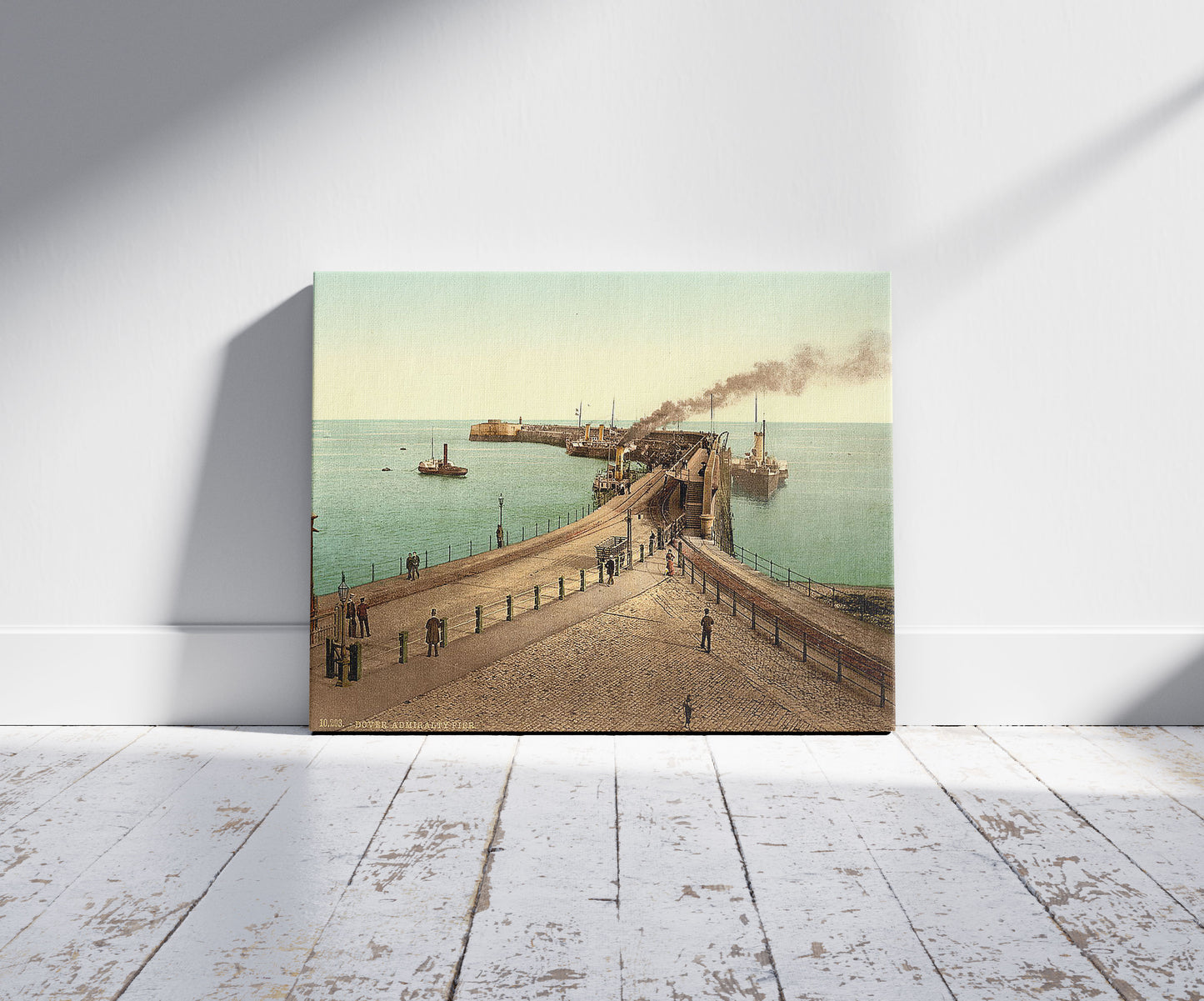 A picture of Admiralty Pier, Dover, England, a mockup of the print leaning against a wall