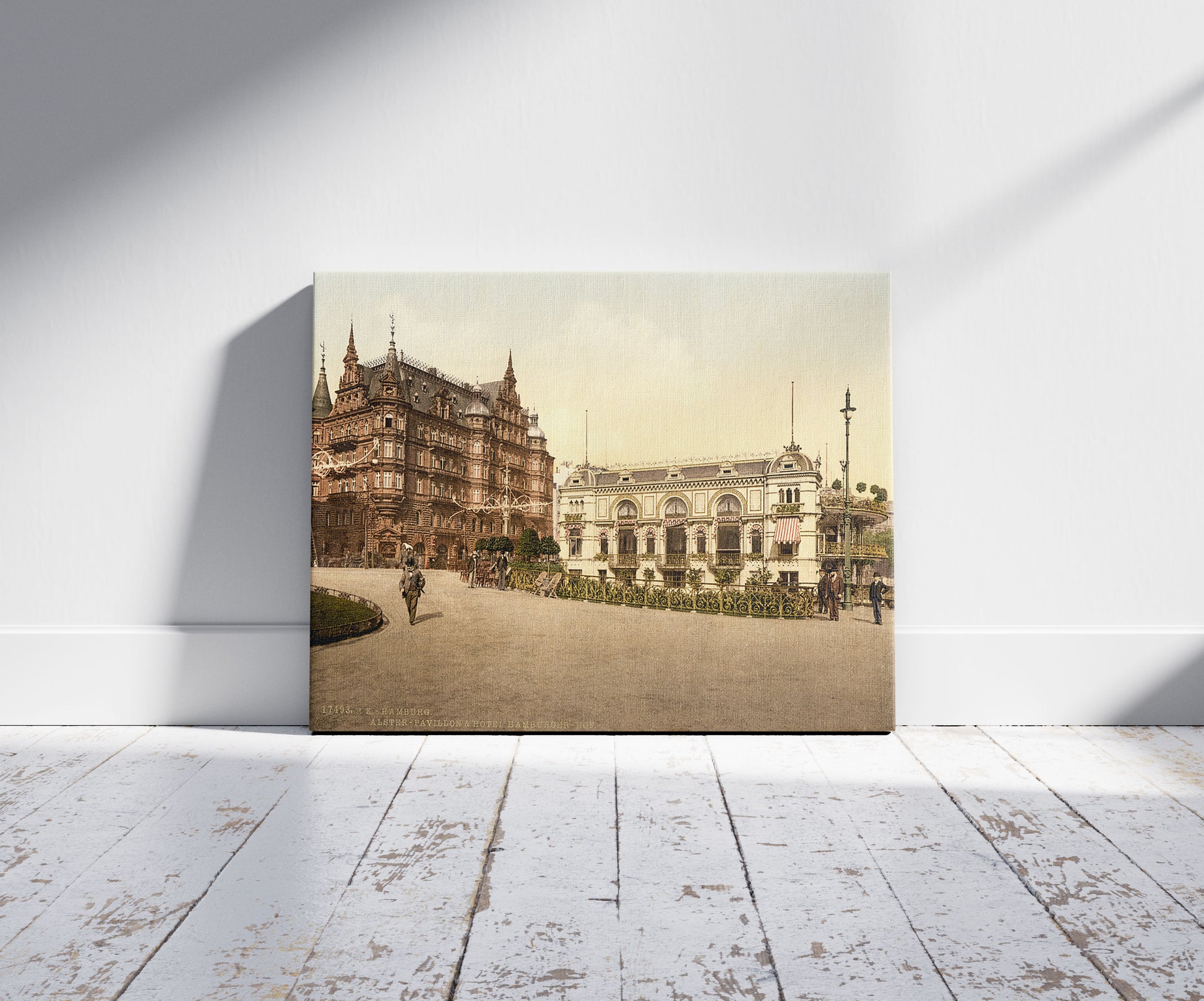 A picture of Alster Pavillion and Hotel Hamburg, Hamburg, Germany, a mockup of the print leaning against a wall