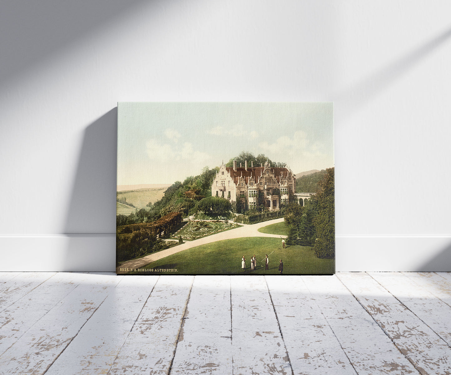 A picture of Altenstein Castle, Thuringia, Germany, a mockup of the print leaning against a wall