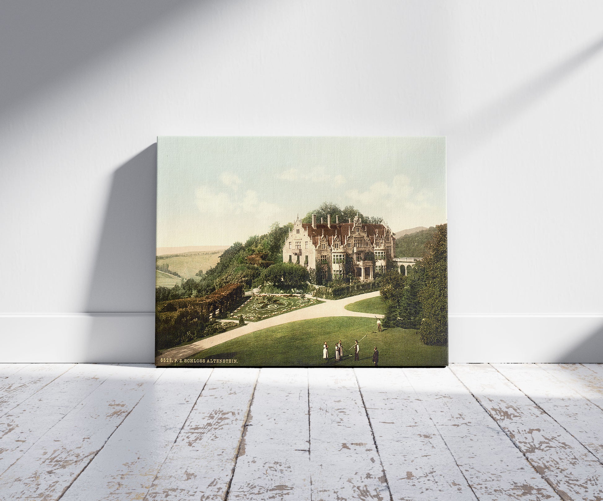 A picture of Altenstein Castle, Thuringia, Germany, a mockup of the print leaning against a wall
