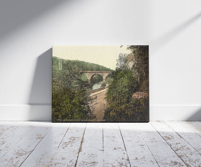 A picture of Ambergate, railway bridge over River Derwent, Derbyshire, England, a mockup of the print leaning against a wall