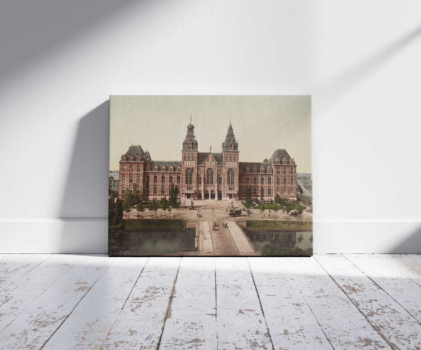 A picture of Amsterdam. Rijks - Museum. Amsterdam. Le Musée National., a mockup of the print leaning against a wall