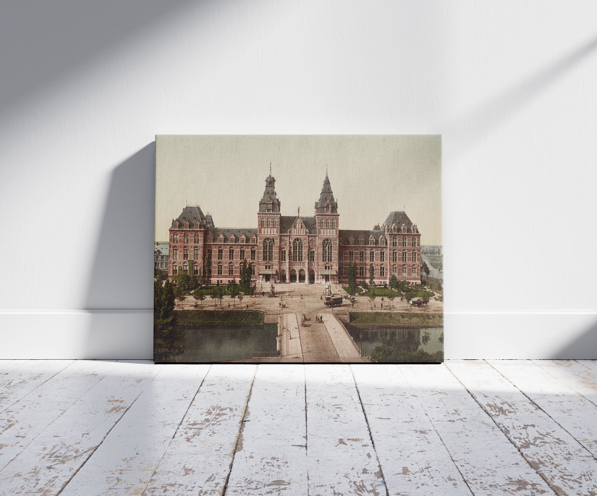 A picture of Amsterdam. Rijks - Museum. Amsterdam. Le Musée National., a mockup of the print leaning against a wall