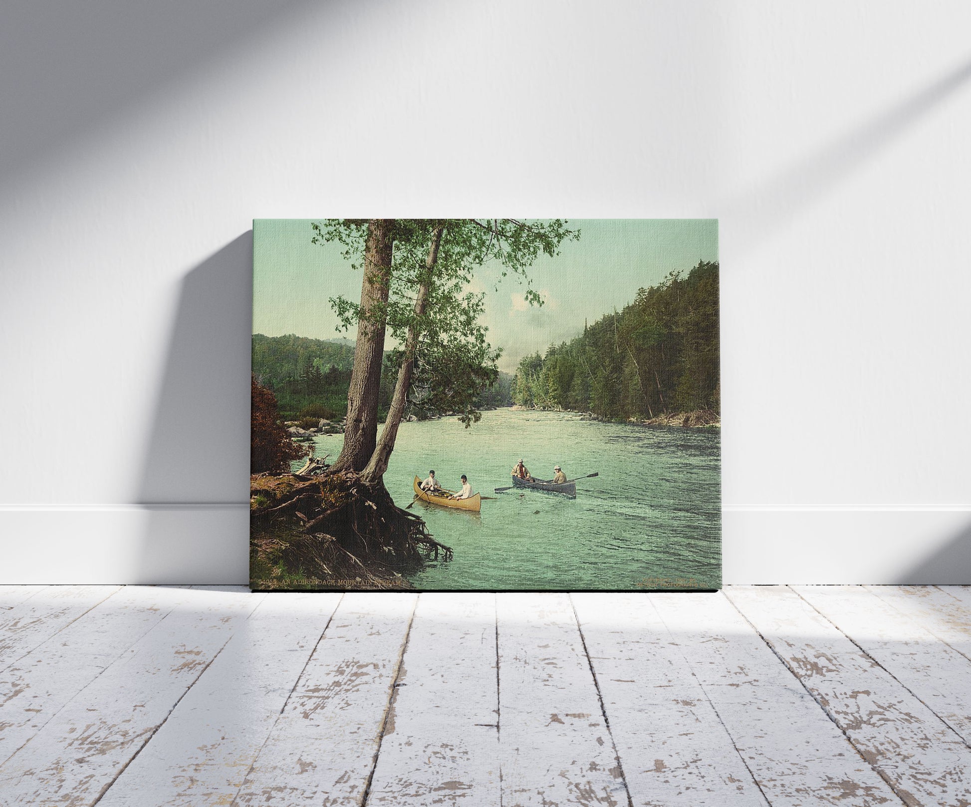 A picture of An Adirondack mountain stream, a mockup of the print leaning against a wall