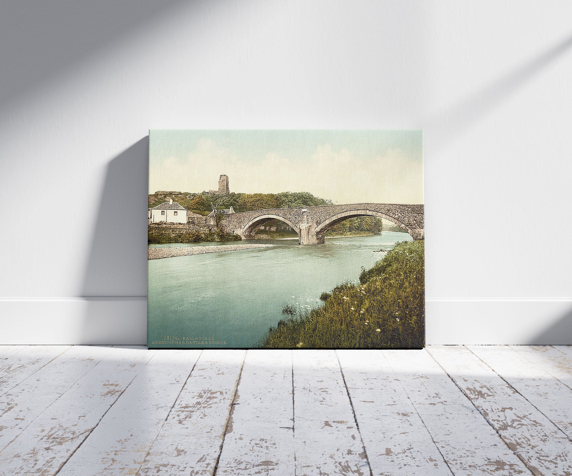 A picture of Ardstinchar Castle and bridge, Ballantrae, Scotland, a mockup of the print leaning against a wall