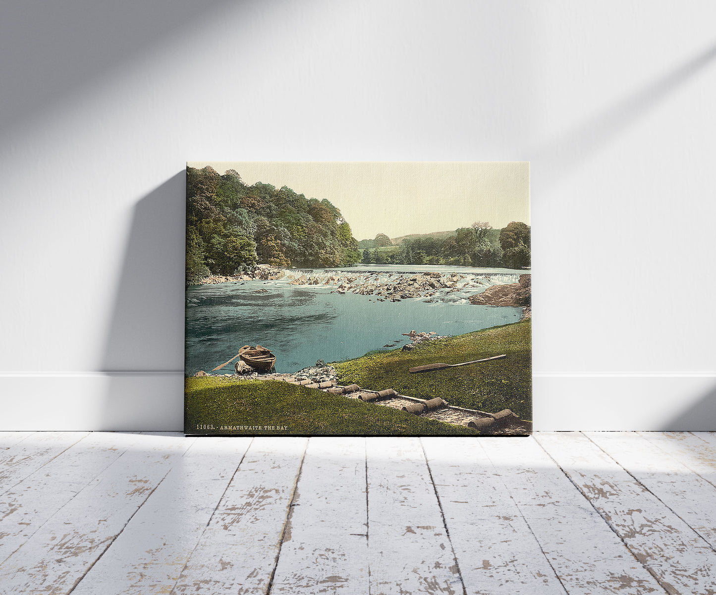 A picture of Armathwaite, the bay, Lake District, England, a mockup of the print leaning against a wall