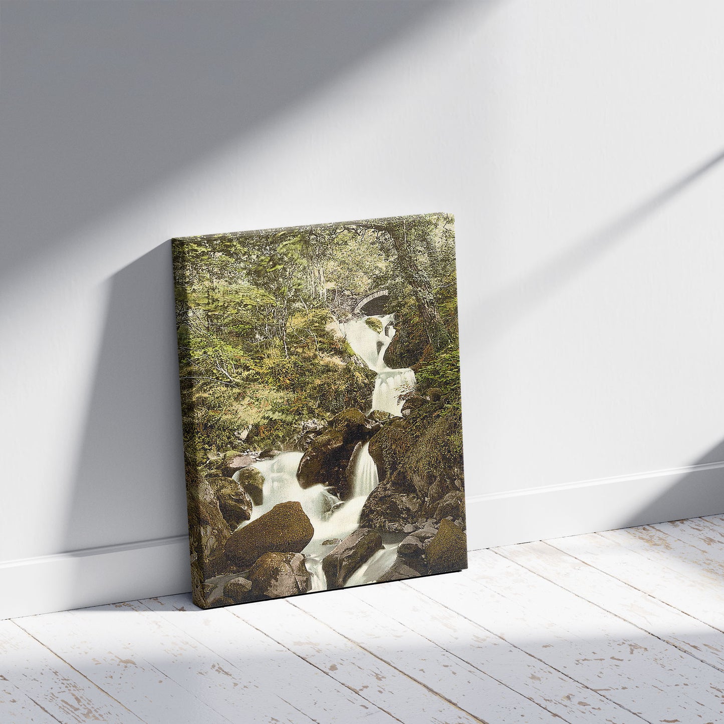 A picture of Arthog Falls, a mockup of the print leaning against a wall