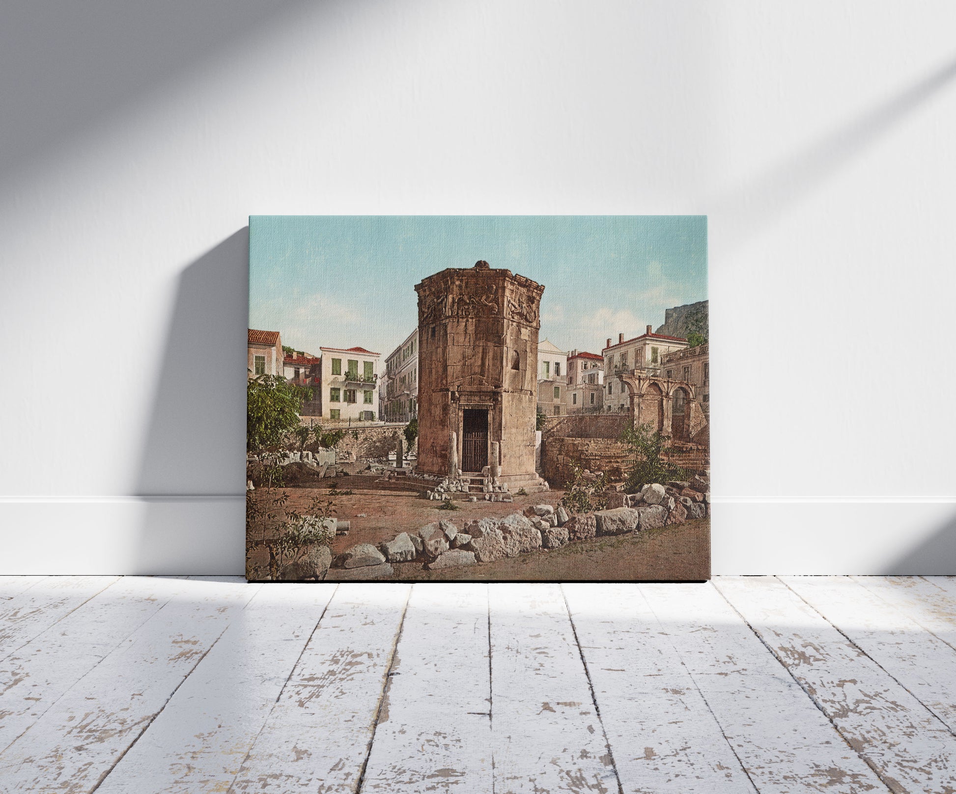 A picture of Athènes. Monument D'Eole, a mockup of the print leaning against a wall