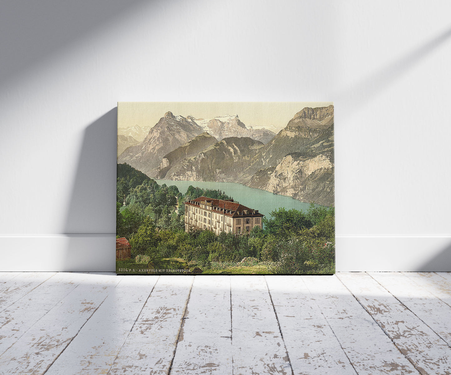 A picture of Axenfels, general view, Lake Lucerne, Switzerland, a mockup of the print leaning against a wall