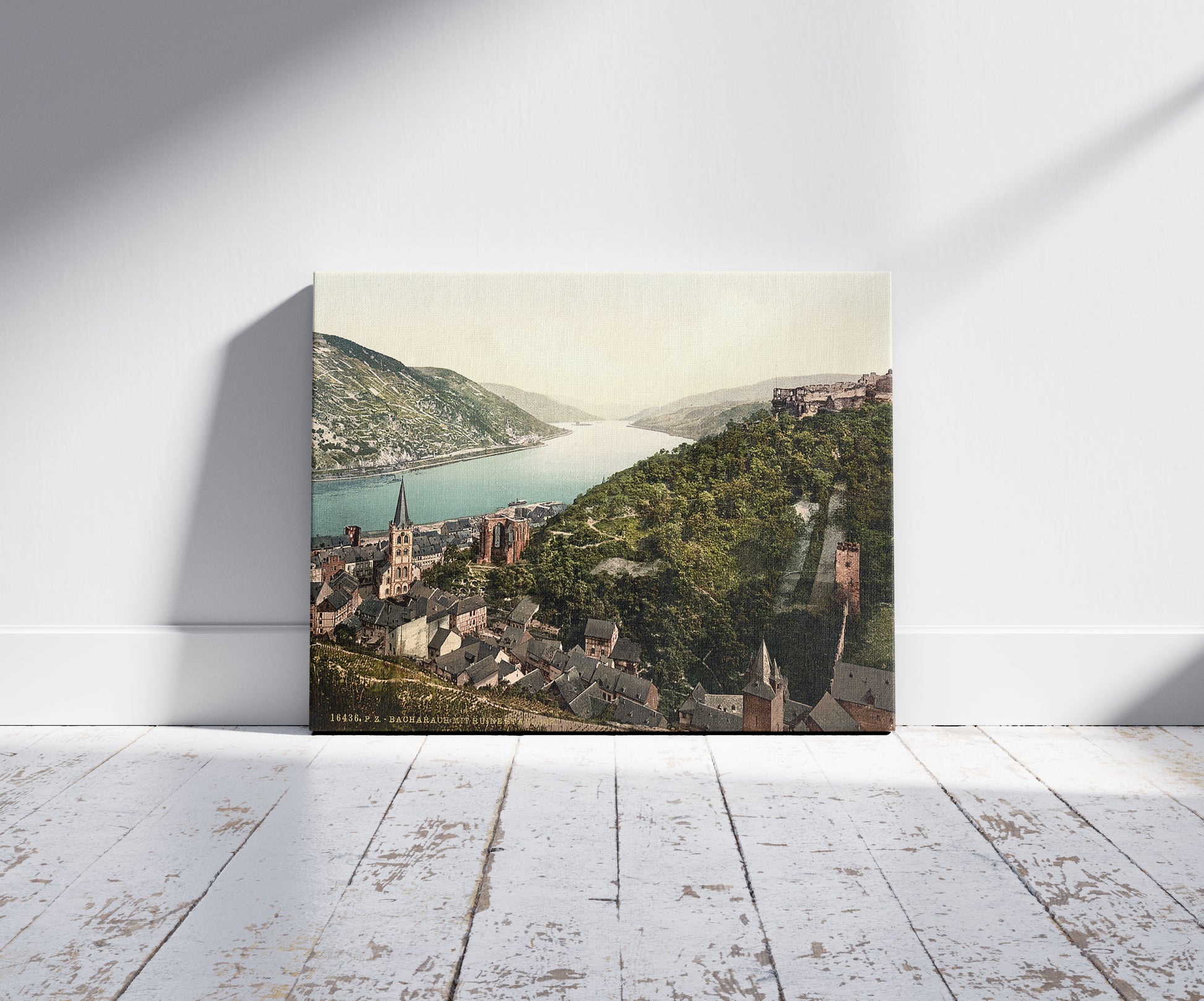 A picture of Bacharach and ruins of Stahleck, the Rhine, Germany, a mockup of the print leaning against a wall