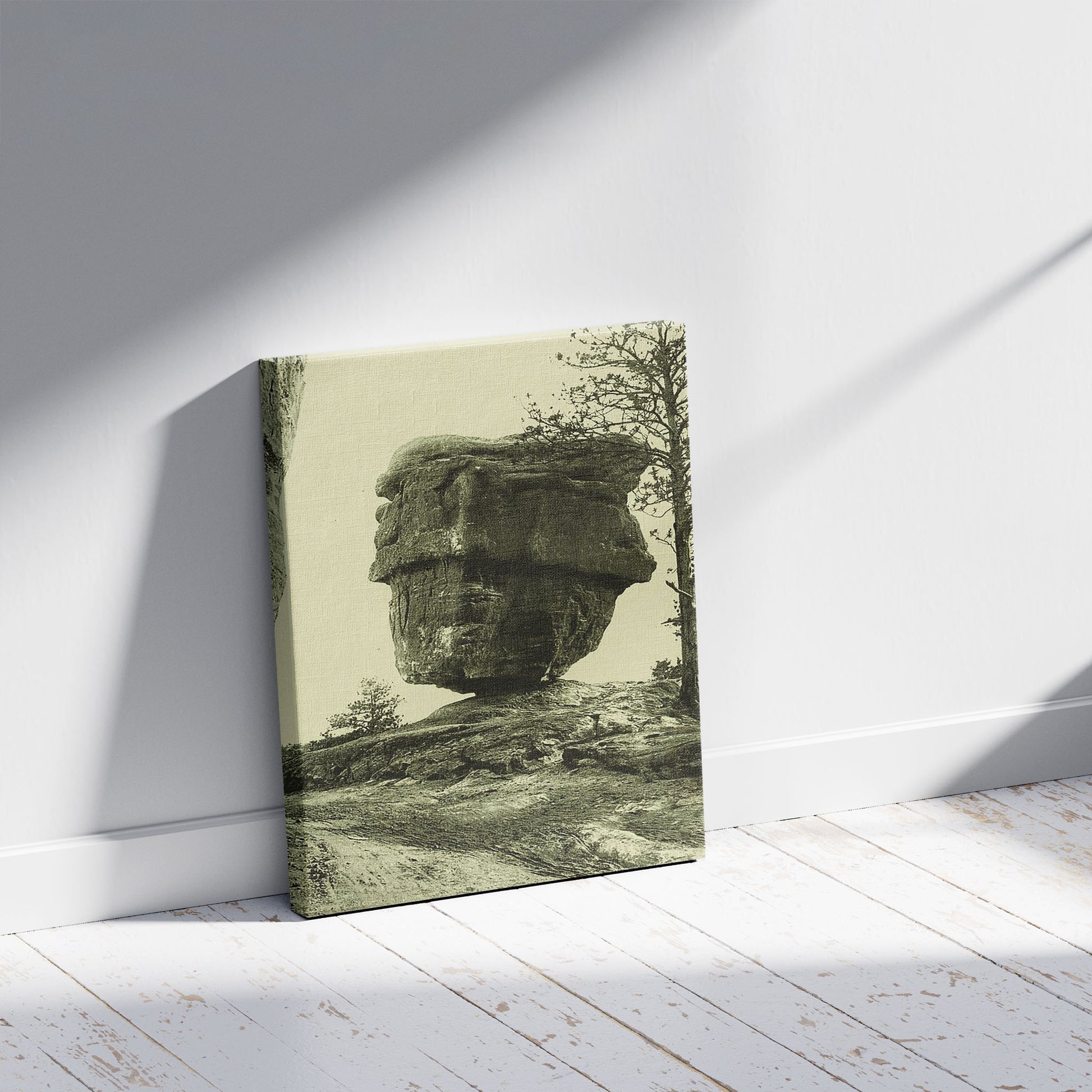 A picture of Balanced Rock, Garden of the Gods, a mockup of the print leaning against a wall