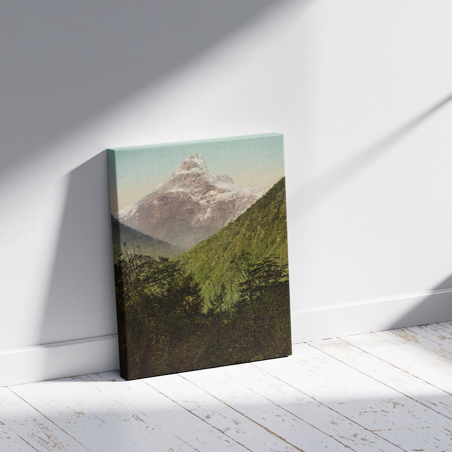 A picture of Balloon Peak, Milford Track, a mockup of the print leaning against a wall