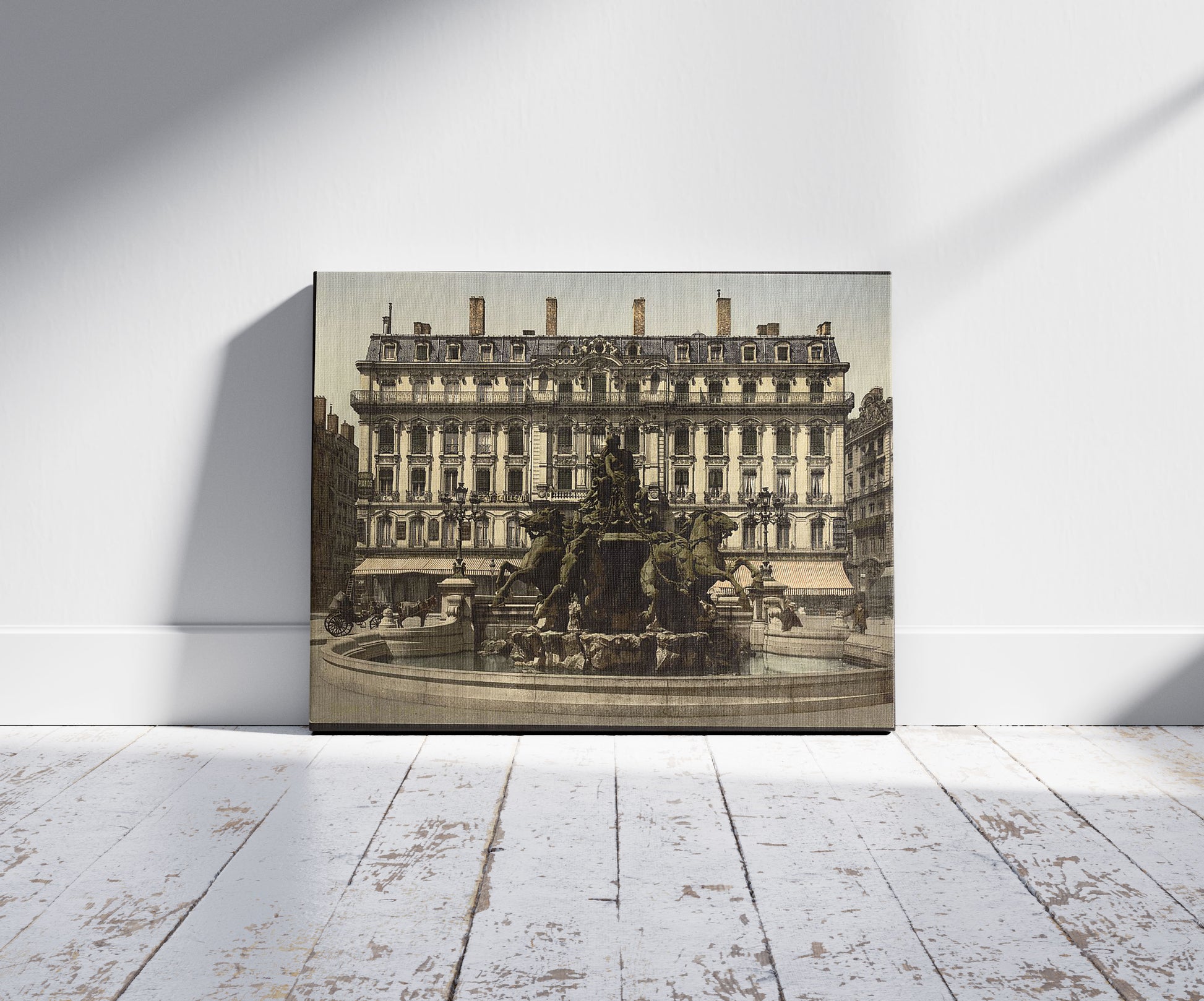 A picture of Bartholdi Fountain, Lyons, France, a mockup of the print leaning against a wall