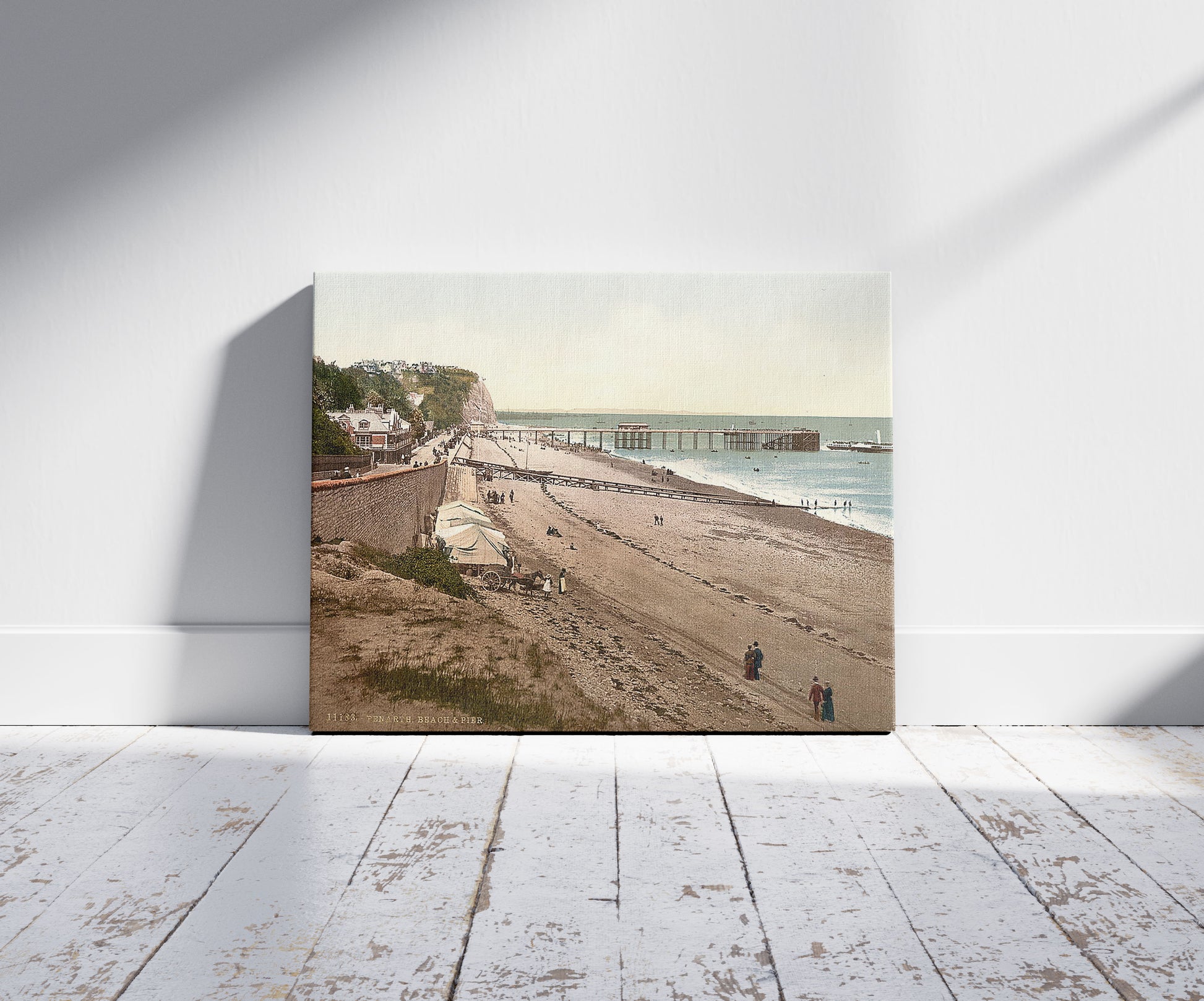 A picture of Beach and pier, Penarth, Wales, a mockup of the print leaning against a wall