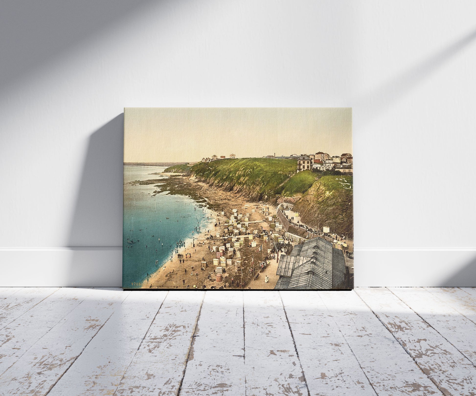 A picture of Beach at bathing time, Granville, France, a mockup of the print leaning against a wall