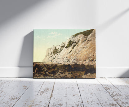 A picture of Beachy Head from below, Eastbourne, England, a mockup of the print leaning against a wall