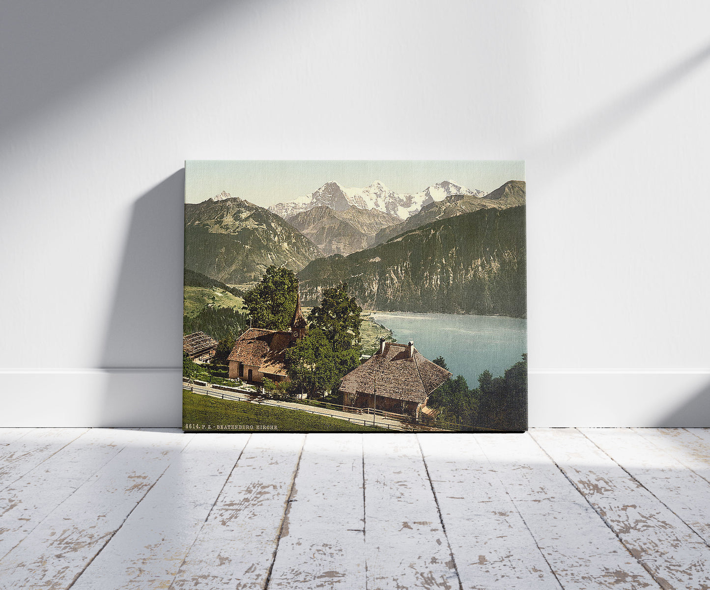 A picture of Beatenburg (i.e., Beatenberg), the church, Bernese Oberland, Switzerland, a mockup of the print leaning against a wall