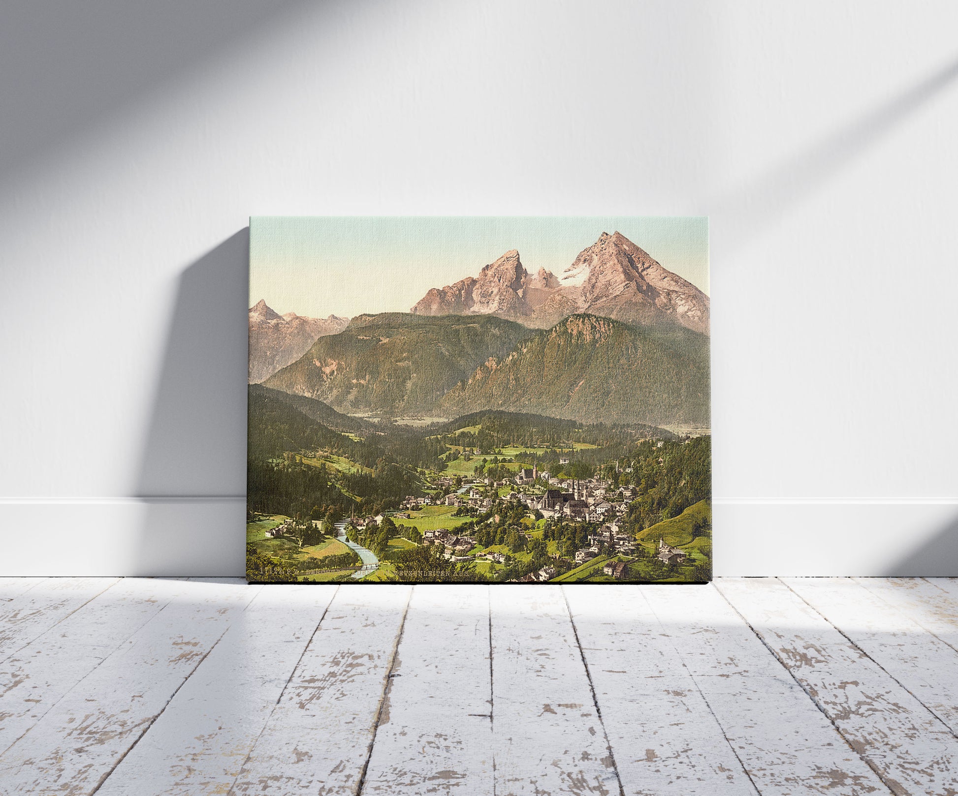 A picture of Berchtesgaden from Metzenleiten Upper Bavaria, Germany, a mockup of the print leaning against a wall