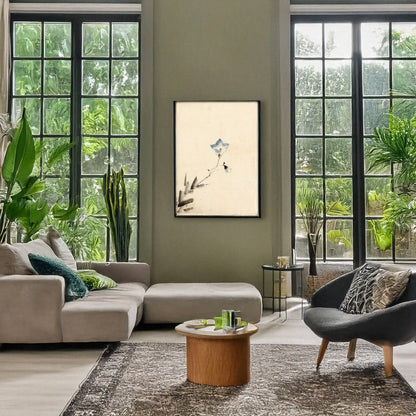 A picture of Blue blossom at the end of a stem, a mockup of the print leaning against a wall