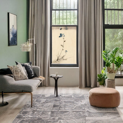 A picture of Blue flower blossom and bud at the end of a stalk, a mockup of the print leaning against a wall