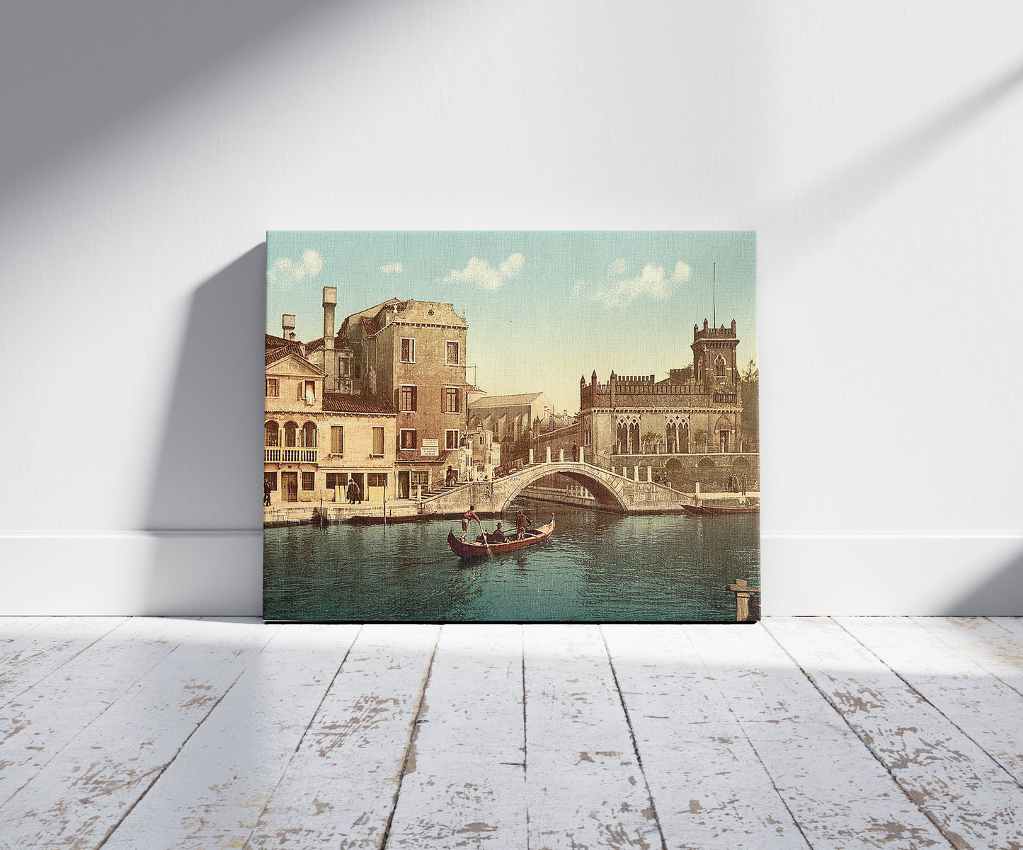 A picture of Bridge and canal, Venice, Italy, a mockup of the print leaning against a wall