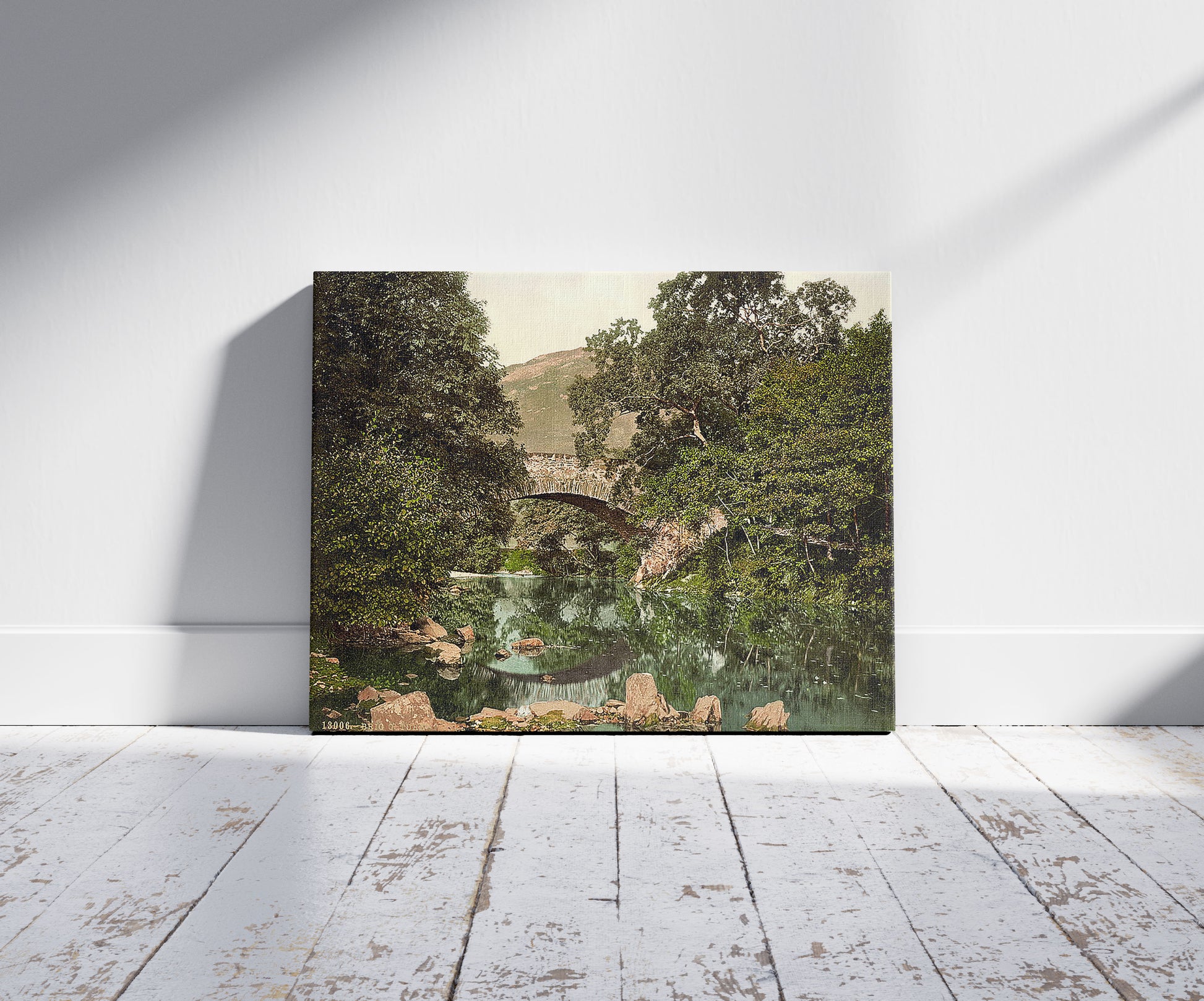 A picture of Brig' o Turk, Trossachs, Scotland, a mockup of the print leaning against a wall