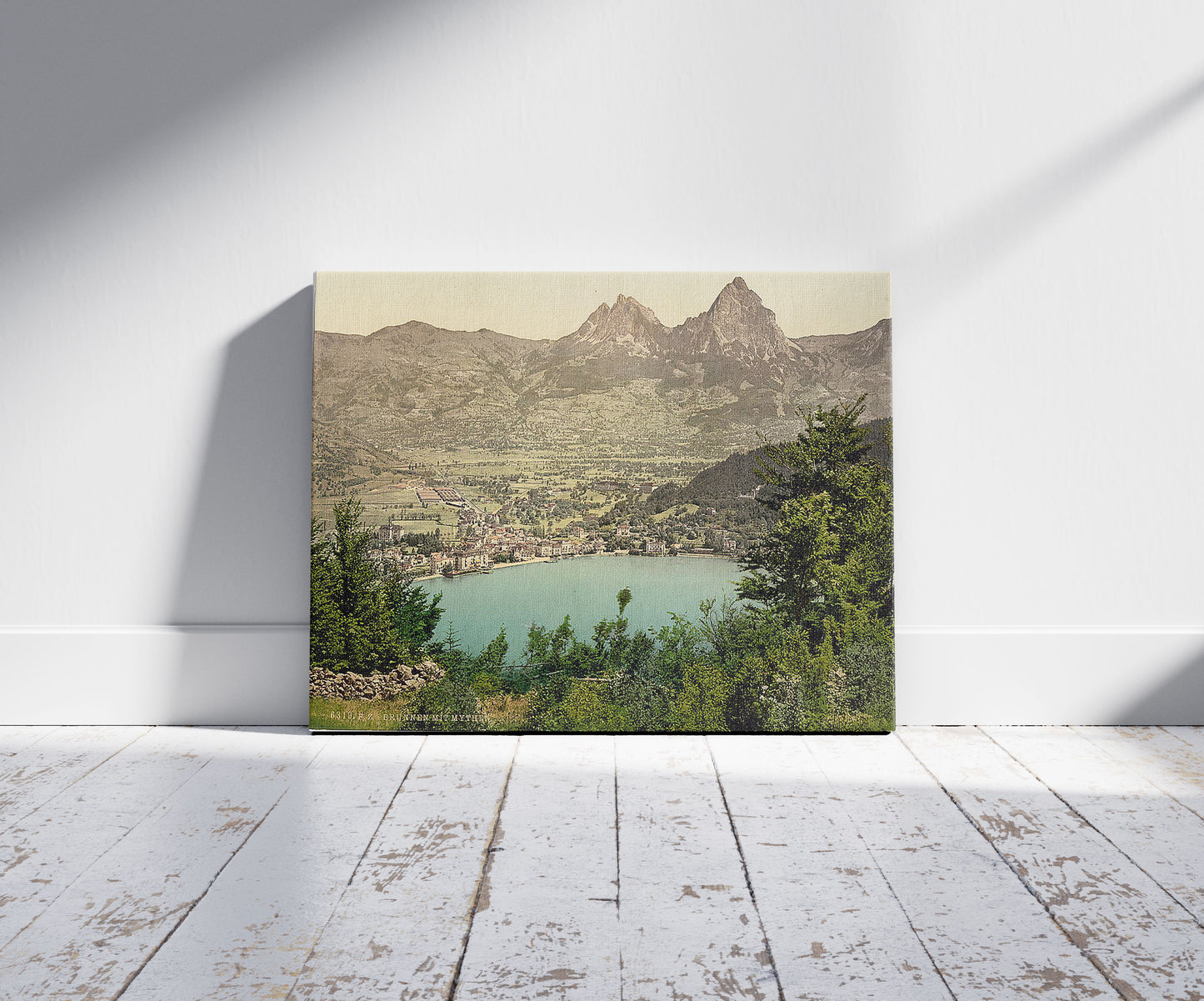 A picture of Brunnen and the Mythen, Lake Lucerne, Switzerland, a mockup of the print leaning against a wall