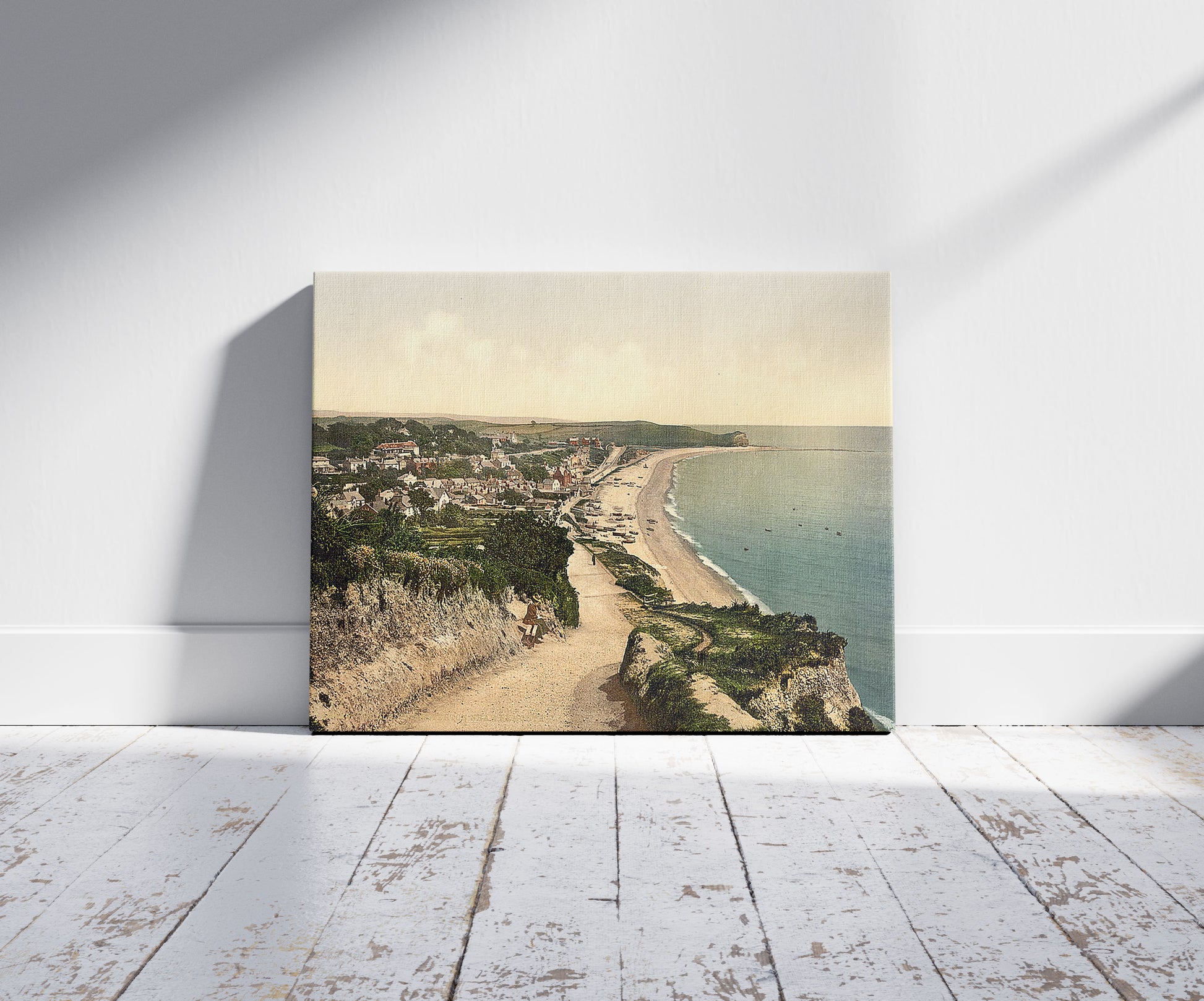 A picture of Budleigh Salterton, Exmouth, England, a mockup of the print leaning against a wall