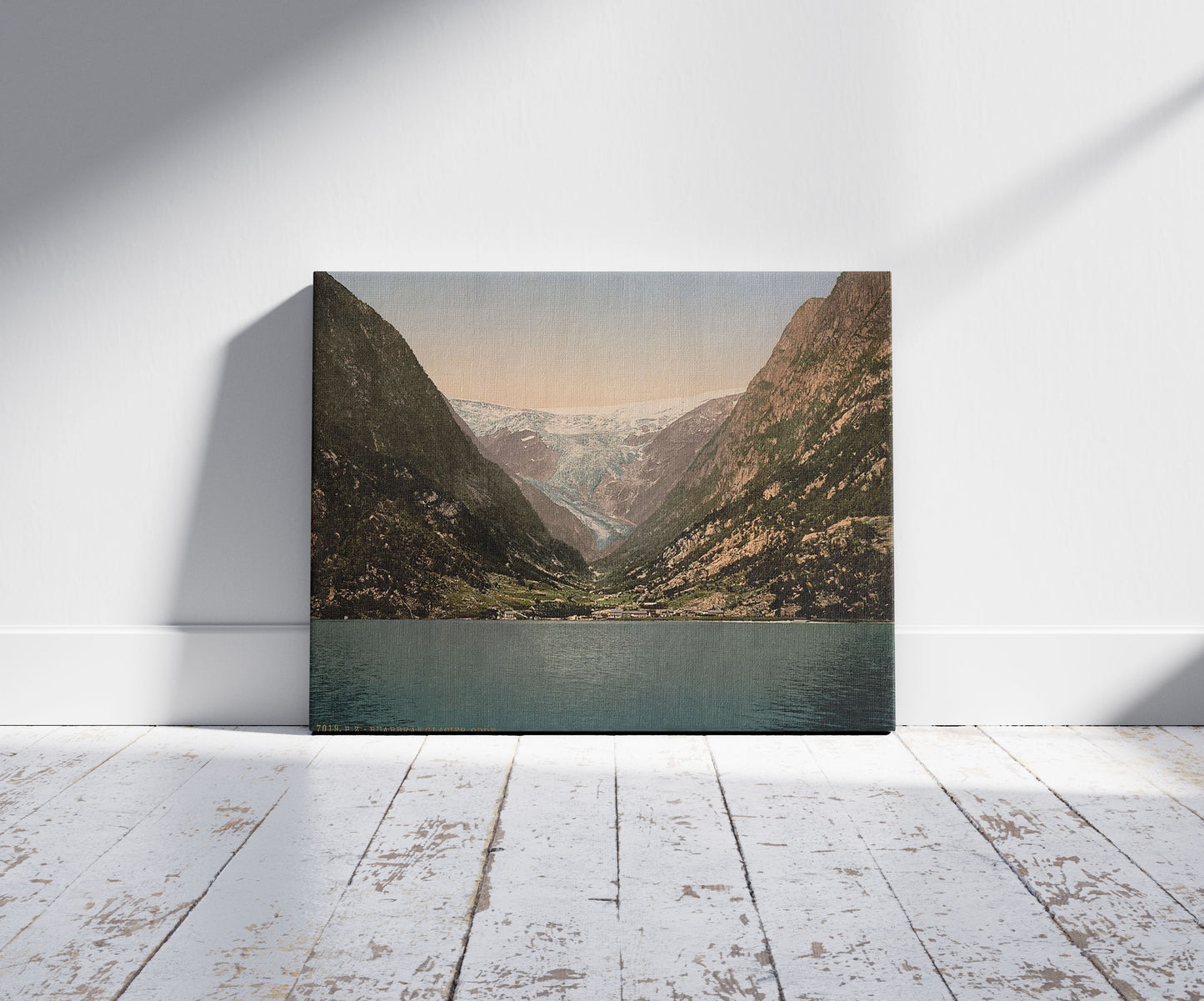 A picture of Buerbrae  (i.e., Buarbreen) Glacier, Odde (i.e. Odda), Hardanger Fjord, Norway, a mockup of the print leaning against a wall