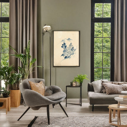 A picture of Buildings nestled among trees in a mountain valley, a mockup of the print leaning against a wall