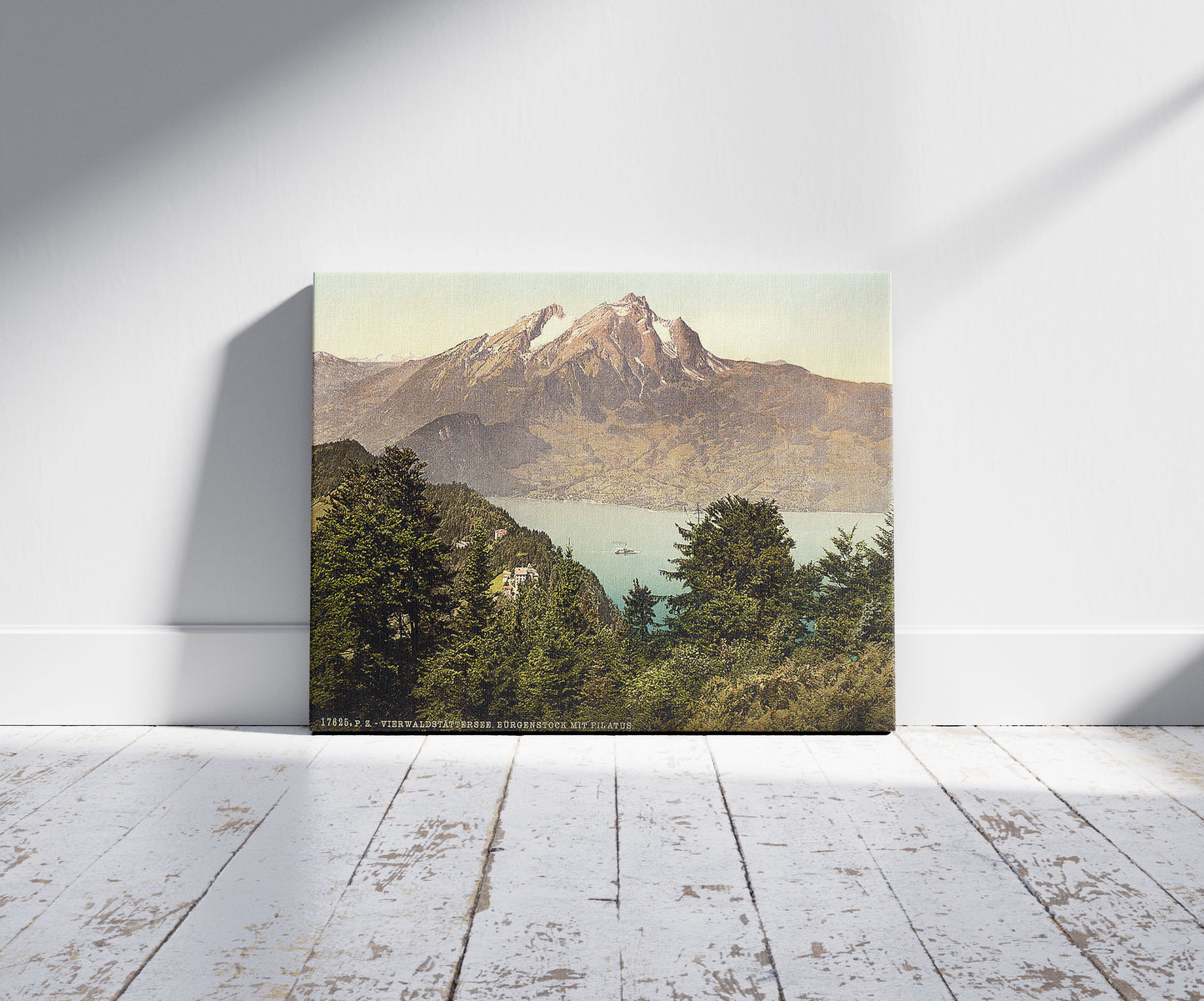 A picture of Burgenstock and Pilatus, Lake Lucerne, Switzerland, a mockup of the print leaning against a wall