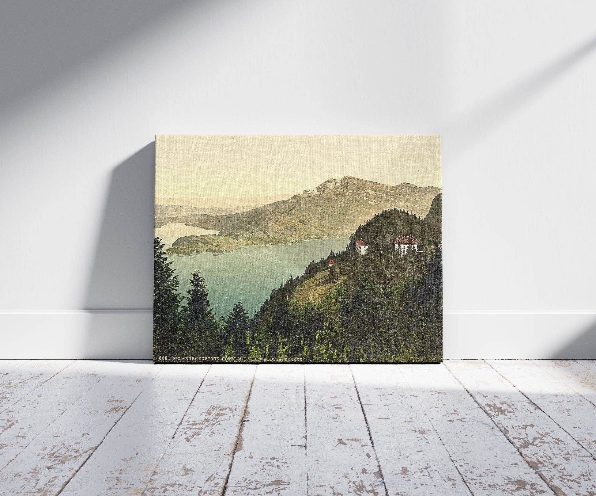 A picture of Burgenstock, hotel and lake, Lake Lucerne, Switzerland, a mockup of the print leaning against a wall