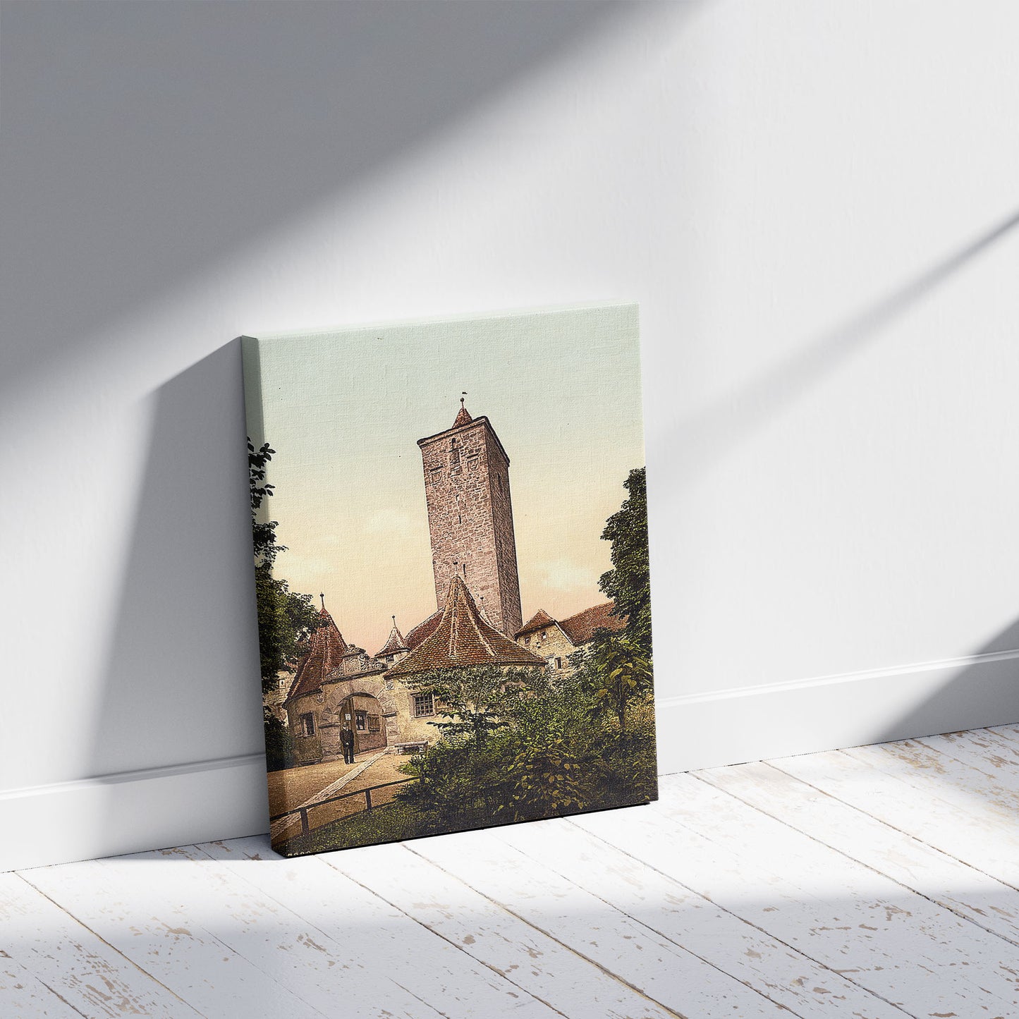 A picture of Burgthor (i.e. Burgtor), Rothenburg (i.e. ob der Tauber), Bavaria, Germany, a mockup of the print leaning against a wall