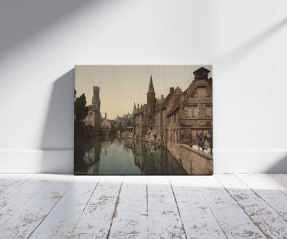A picture of Canal and Belfry, Bruges, Belgium, a mockup of the print leaning against a wall