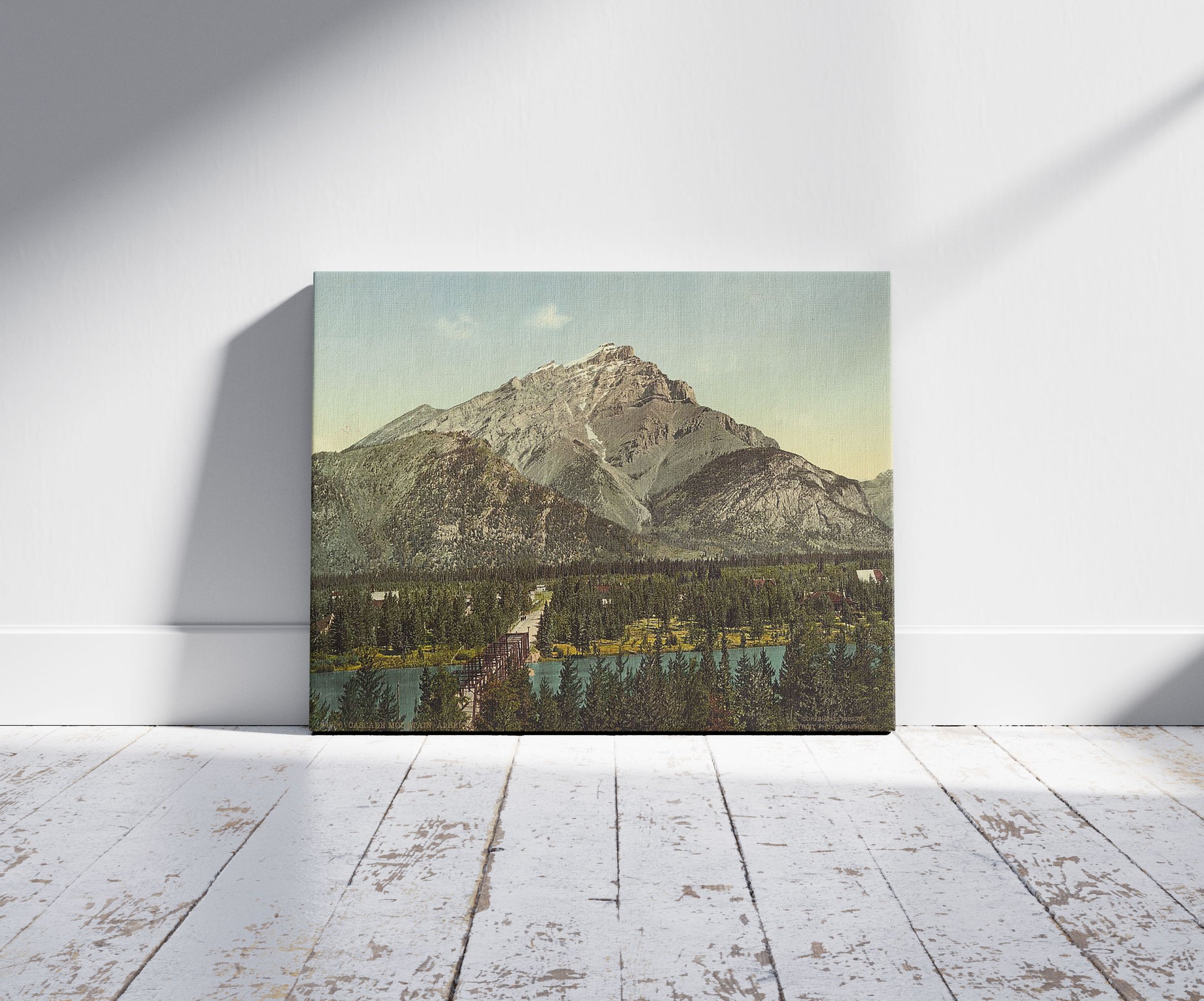 A picture of Cascade Mountain, Alberta, a mockup of the print leaning against a wall