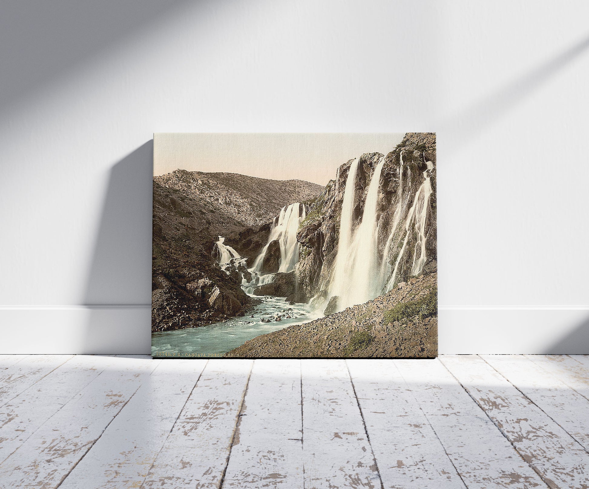 A picture of Cascade, near Knin, Dalmatia, Austro-Hungary, a mockup of the print leaning against a wall