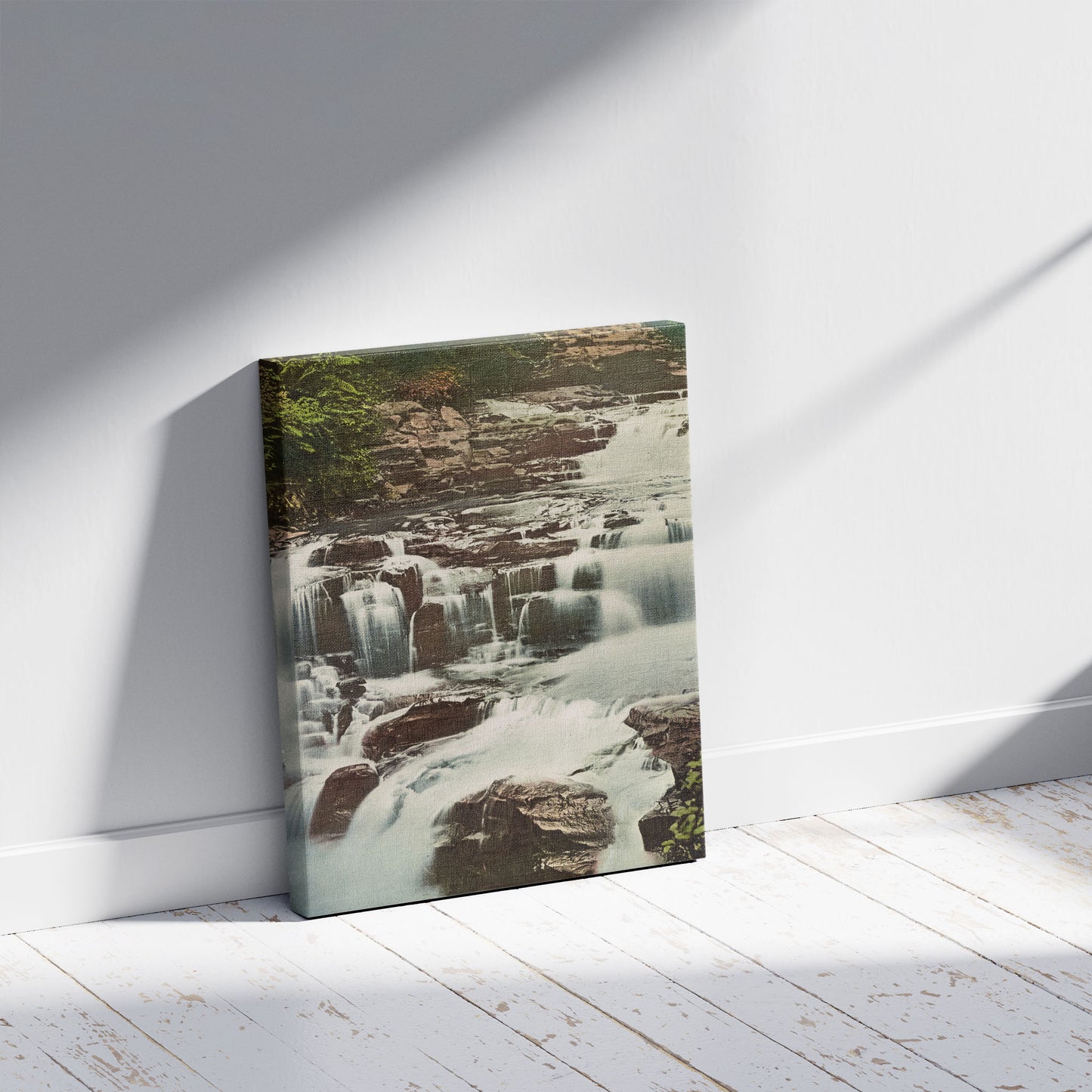 A picture of Cascades, Fitzroy Falls, Moss Vale, N.S.W., a mockup of the print leaning against a wall