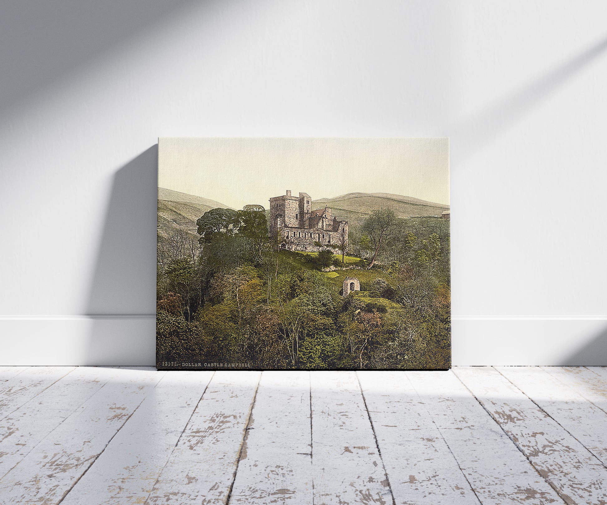 A picture of Castle Campbell, Dollar, Scotland, a mockup of the print leaning against a wall