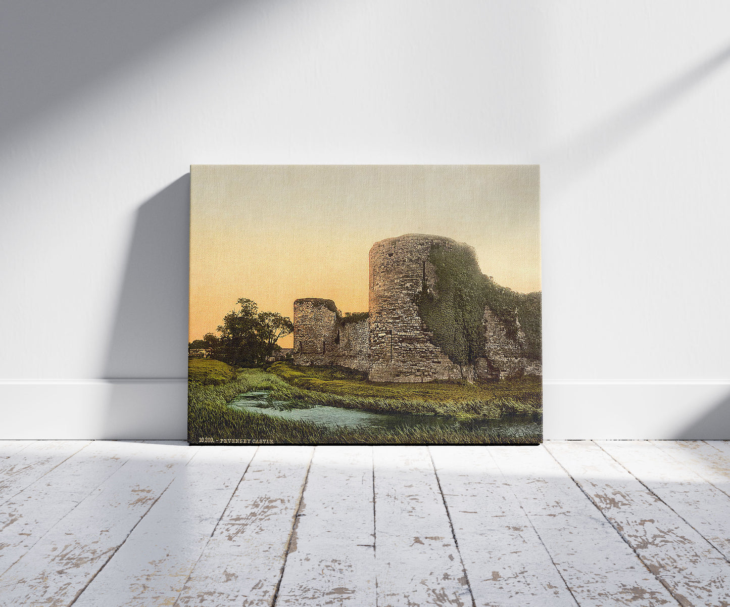 A picture of Castle, Pevensey, England, a mockup of the print leaning against a wall