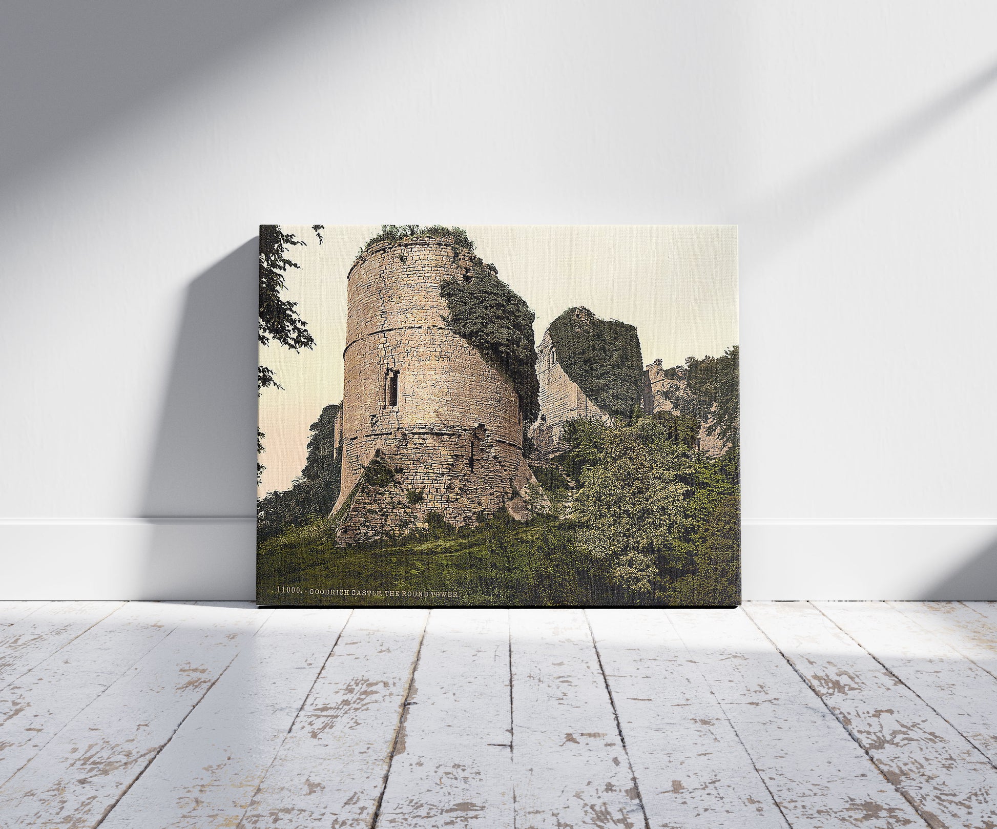 A picture of Castle, the round tower, Goodrich, England, a mockup of the print leaning against a wall