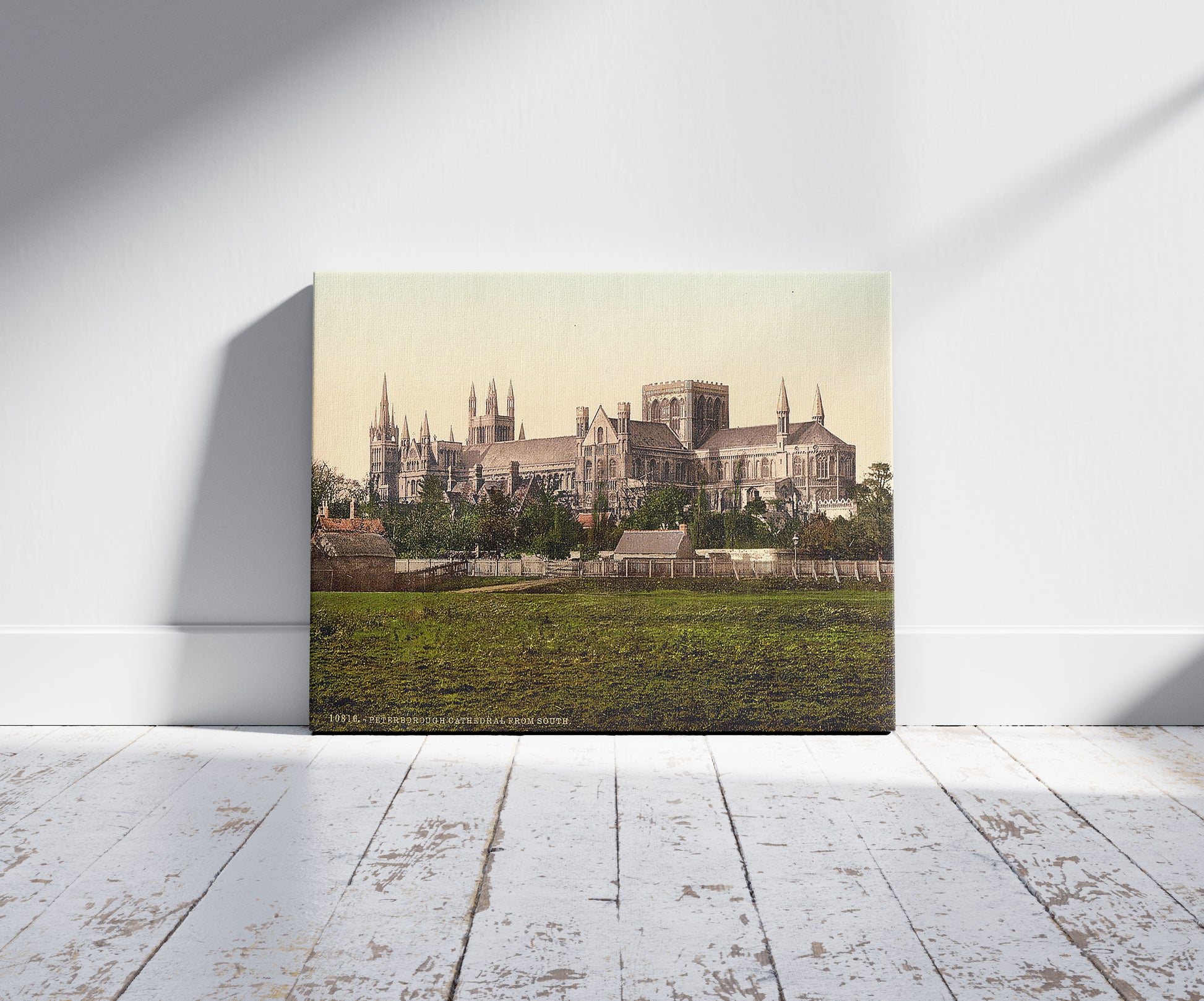 A picture of Cathedral, from south, Peterborough, England, a mockup of the print leaning against a wall