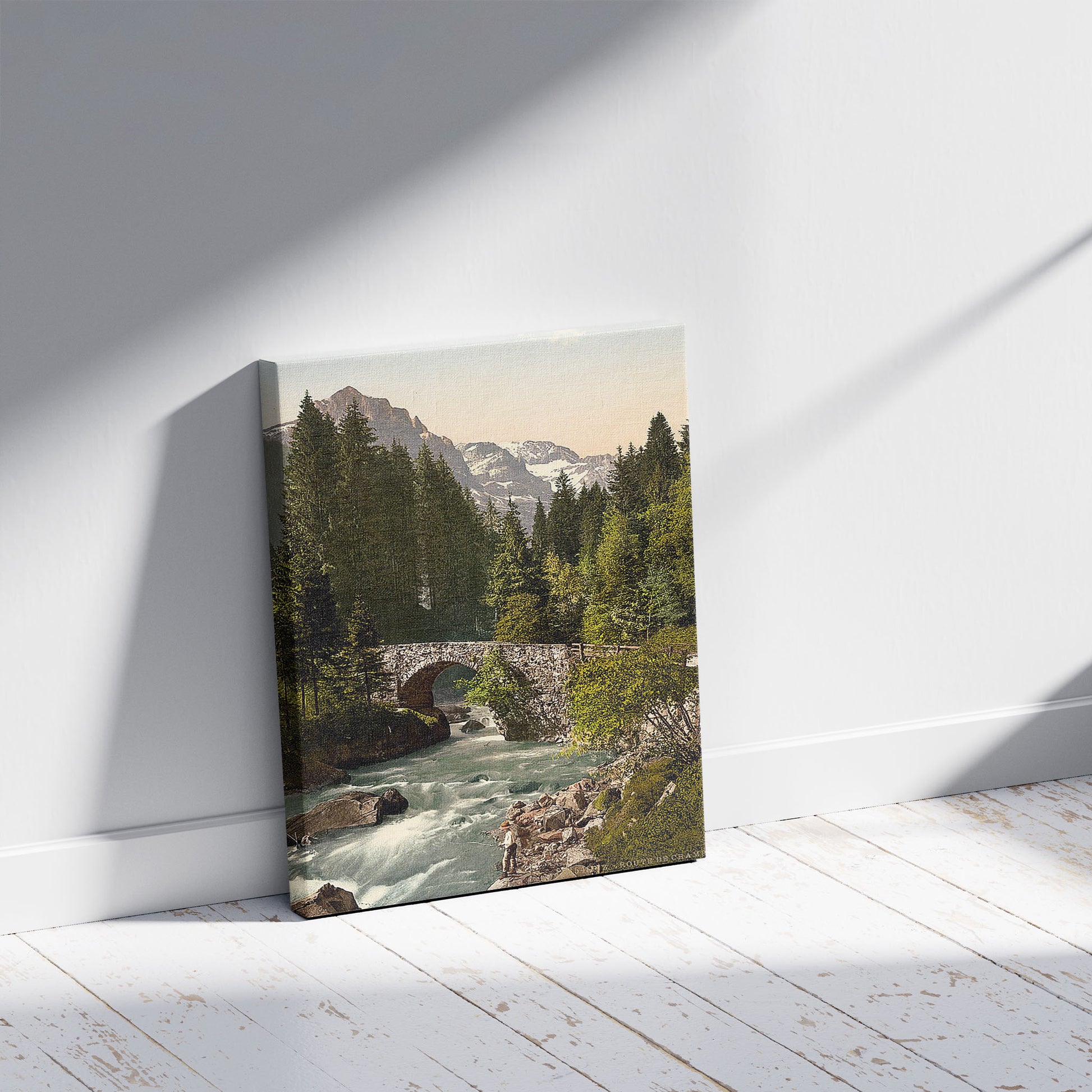 A picture of Champéry, Moulins Bridge and Dent du Midi on the Road to Champéry, Valais, Alps of, Switzerland, a mockup of the print leaning against a wall