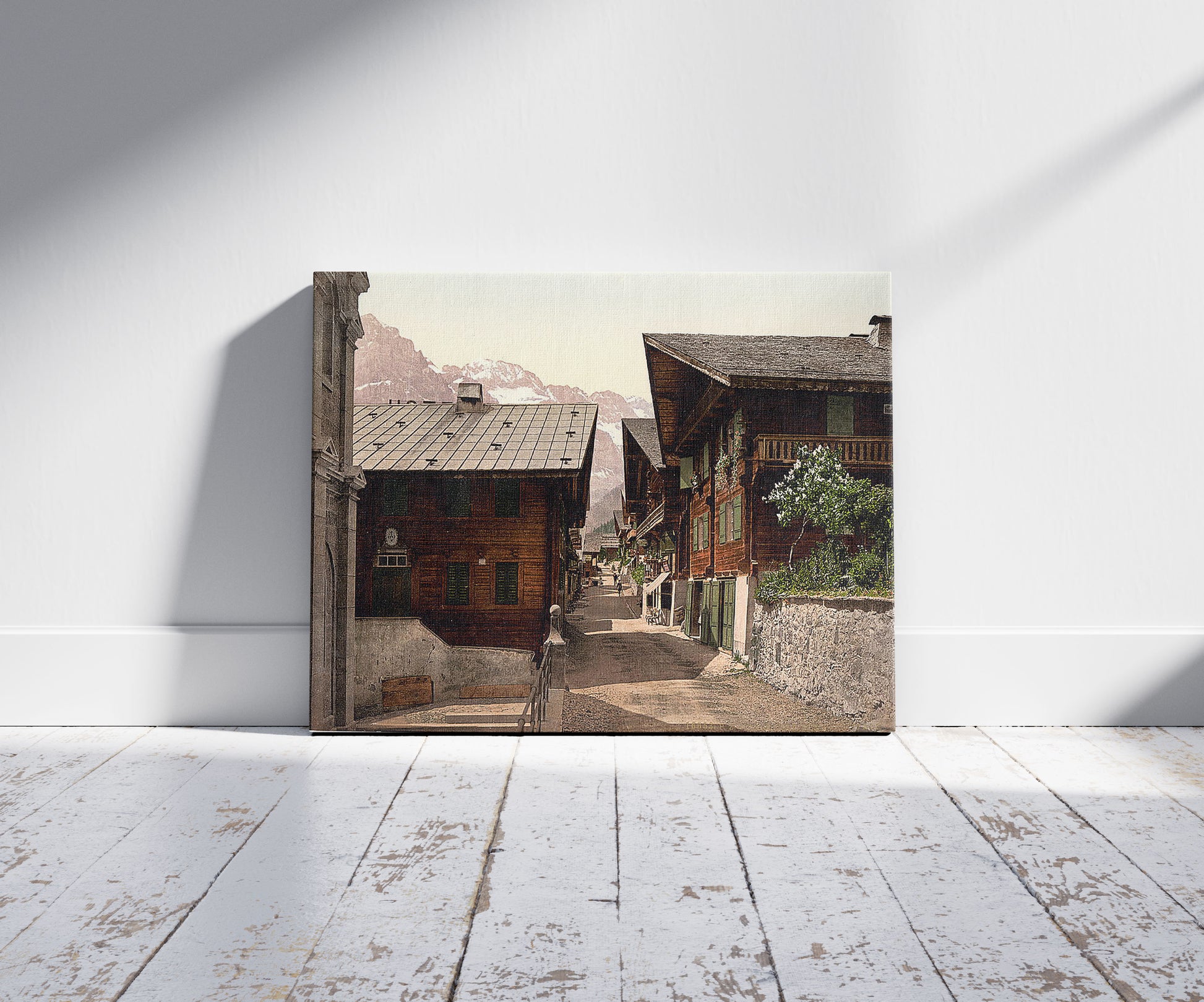 A picture of Champéry, Principal Street, Valais, Alps of, Switzerland, a mockup of the print leaning against a wall