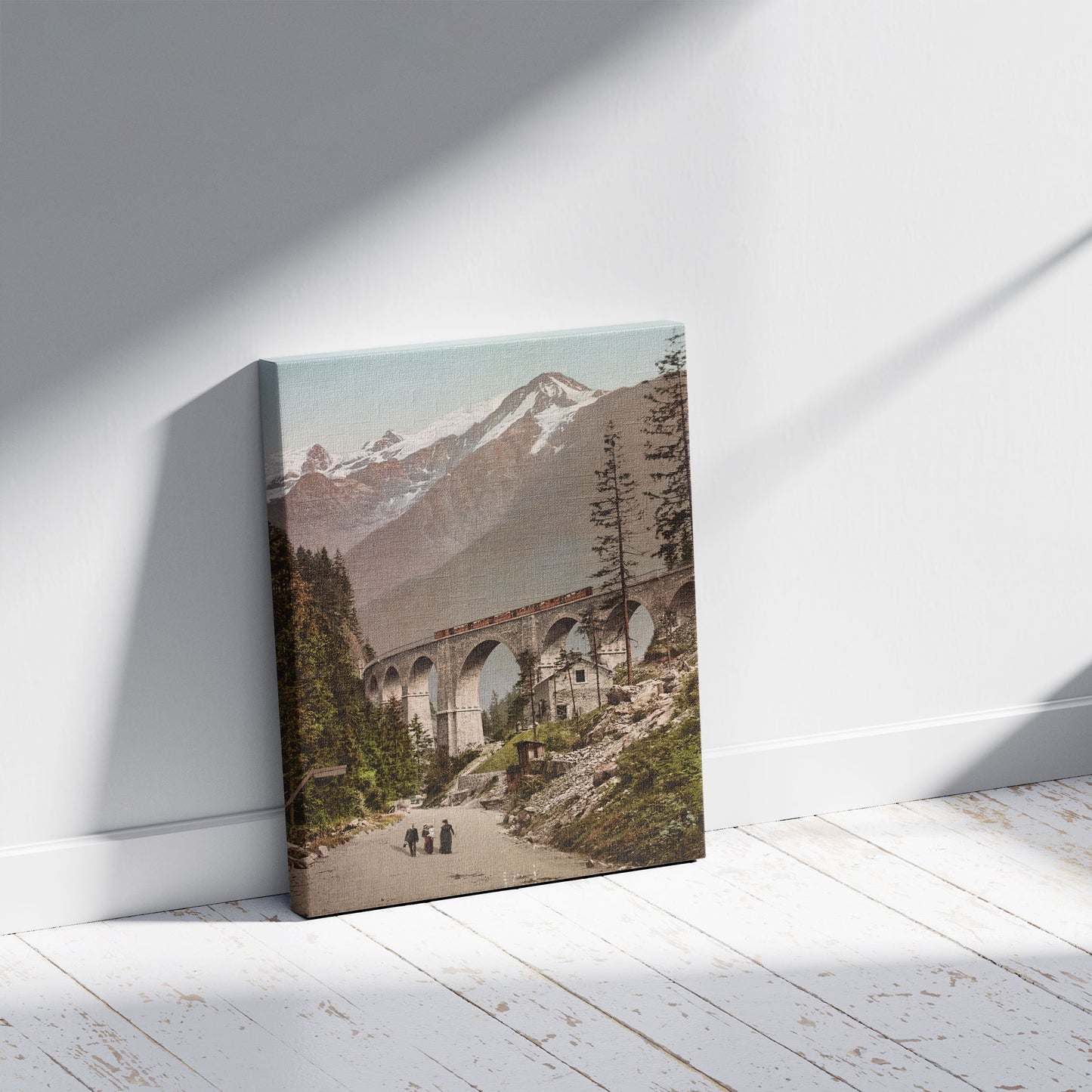 A picture of Chemin de Fer Fayet-Chamonix . Le viaduc avec vue sur le Montblanc, a mockup of the print leaning against a wall