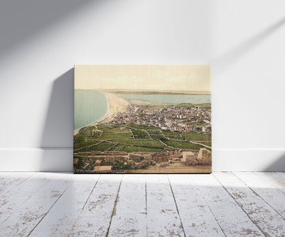 A picture of Chesil Beach, Portland, England, a mockup of the print leaning against a wall