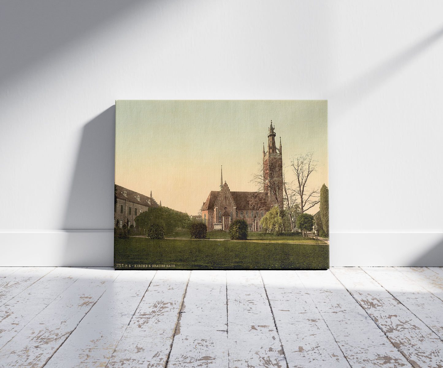 A picture of Church and Grey House, park of Worlitz, Anhalt, Germany, a mockup of the print leaning against a wall
