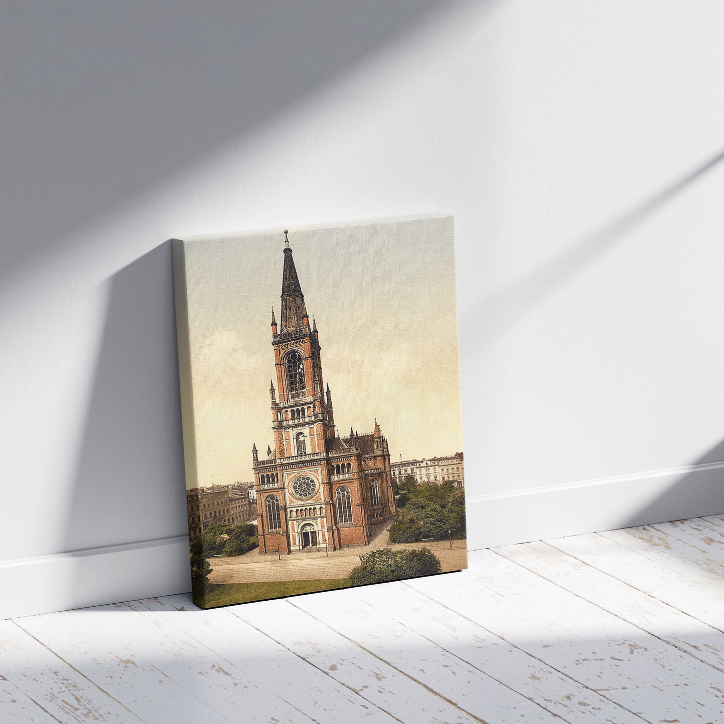 A picture of Church St. Jean, Dusseldorf, the Rhine, Germany, a mockup of the print leaning against a wall