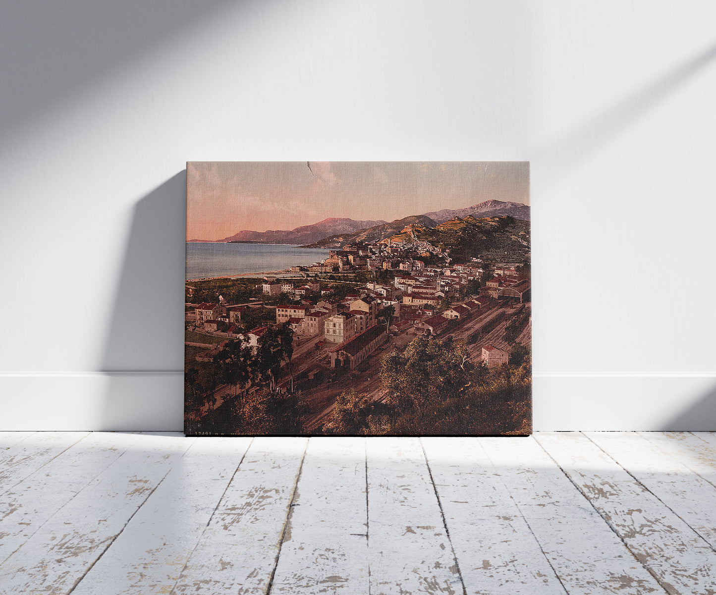 A picture of Cityscape, Ventimiglia, Riviera, a mockup of the print leaning against a wall