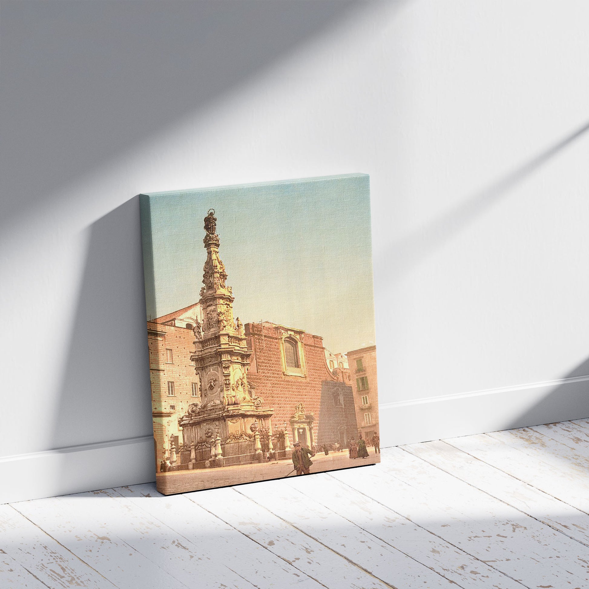 A picture of Column of the Virgin, Piazza Trinità Maggiore, Naples, Italy, a mockup of the print leaning against a wall